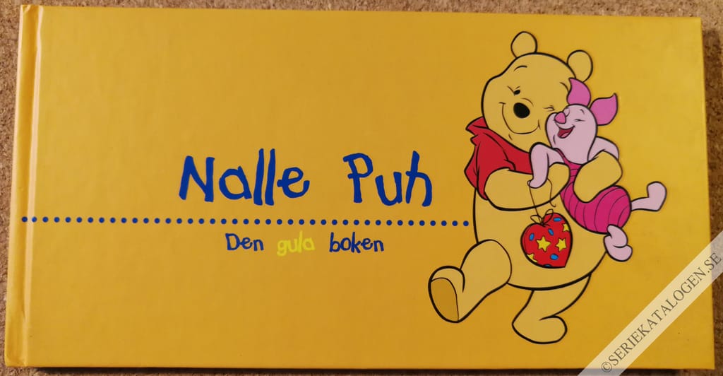 Framsida på Nalle Puhs klokbok Den gula boken (2004)